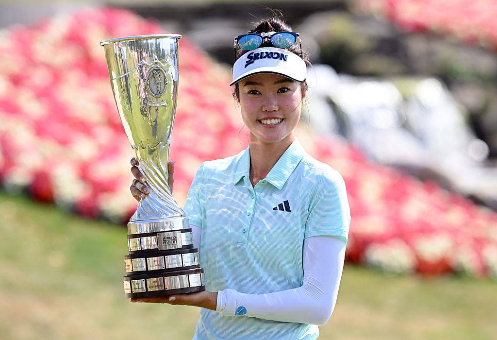 Grace Kim poses with the trophy after winning the Amundi Evian Championship in 2025